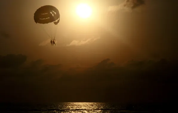 Sea, the sun, clouds, sunset, stay, romance, parachute, pair