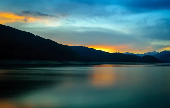 The sky, clouds, sunset, mountains, lake, reflection, mirror