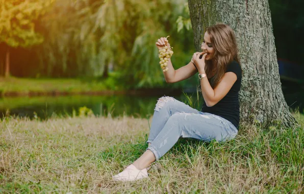 Girl, tree, grapes
