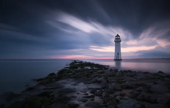 Sea, the sky, clouds, stones, lighthouse, the evening