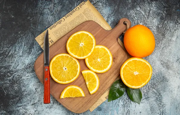 Oranges, knife, cutting Board