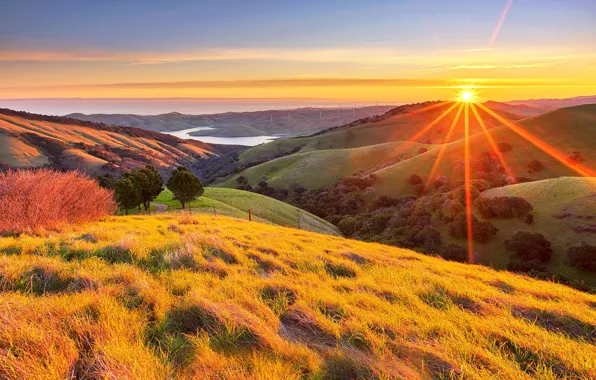 Picture the sun, rays, hills