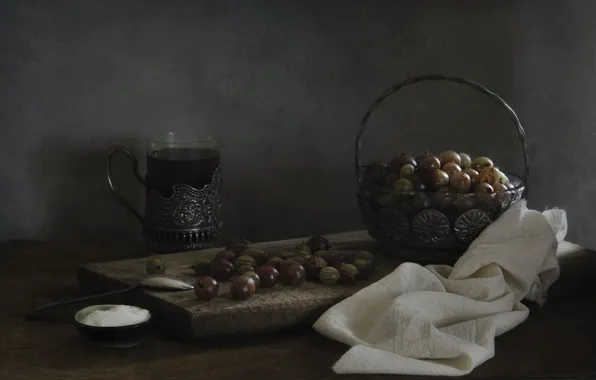 Light, glass, berries, the dark background, table, tea, towel, spoon