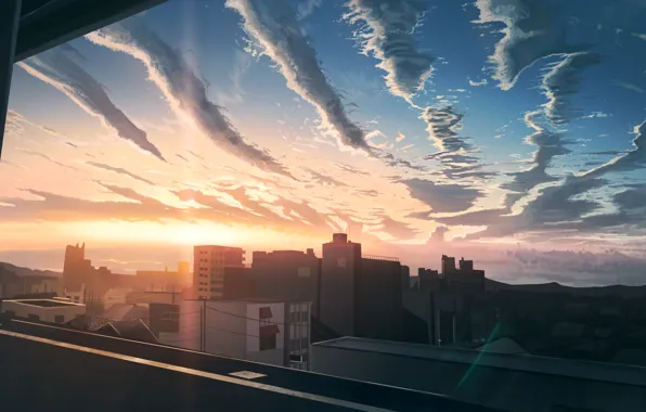 Sunset, the city, the view from the window
