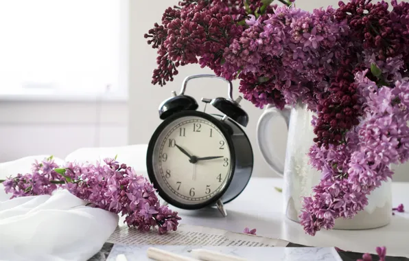 Table, watch, pencils, alarm clock, vase, notebook, lilac, bokeh