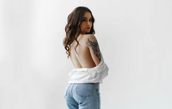 Picture look, girl, pose, back, jeans, brunette, tattoo, light background