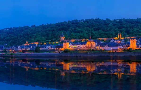 The sky, water, trees, lights, reflection, river, wall, shore