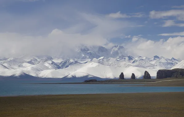 Snow, mountains, shore, pond