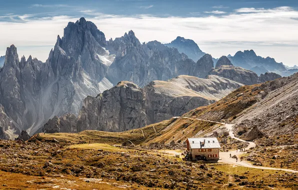 The sky, the sun, clouds, mountains, house, stones, rocks, trail