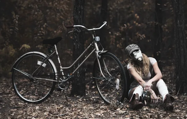 Girl, bike, gas mask