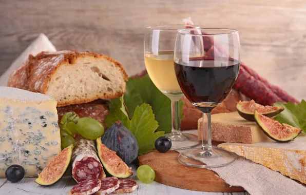 Wine, cheese, bread, grapes, leaves, figs, kalbasa