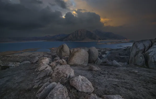 Picture road, mountains, clouds, lights, lake, stones, twilight