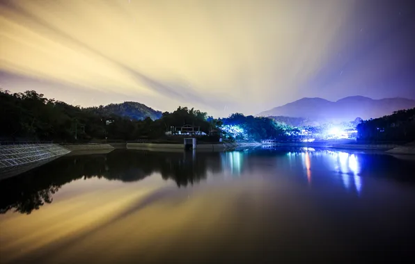 Picture the sky, lights, lake, hills, building, glow
