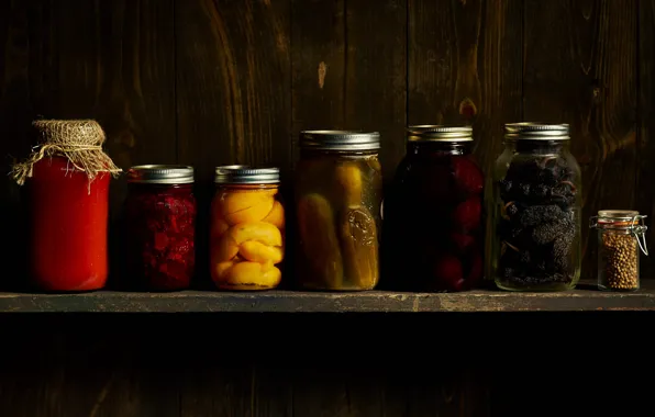 The dark background, shelf, banks, cellar, jam, cucumbers, pickles, billet