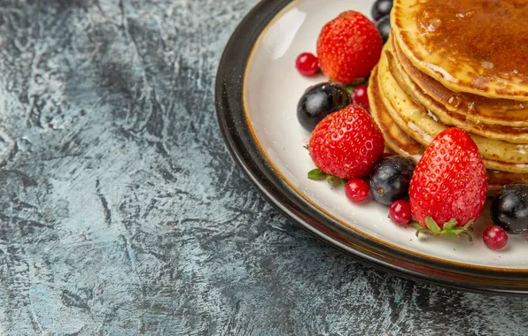 Berries, grey background, pancakes