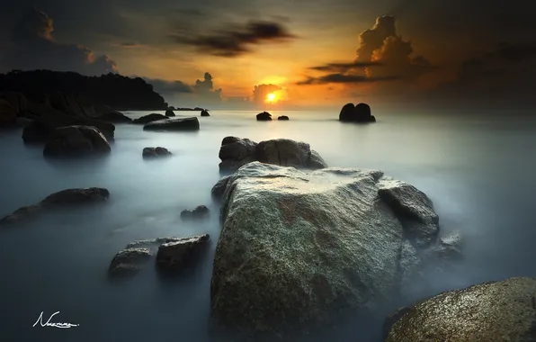 The sun, stones, the ocean, dawn, horizon