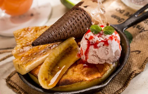 Picture ice cream, bananas, mint, biscuit, creme brulee, waffle cone, strawberry syrup
