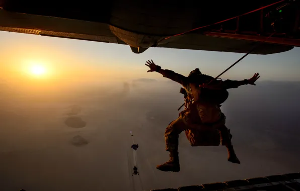 The sky, the sun, the plane, skydivers