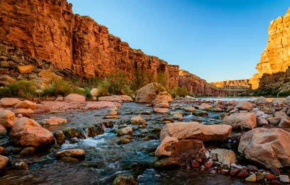 Picture the sky, mountains, river, stones, rocks