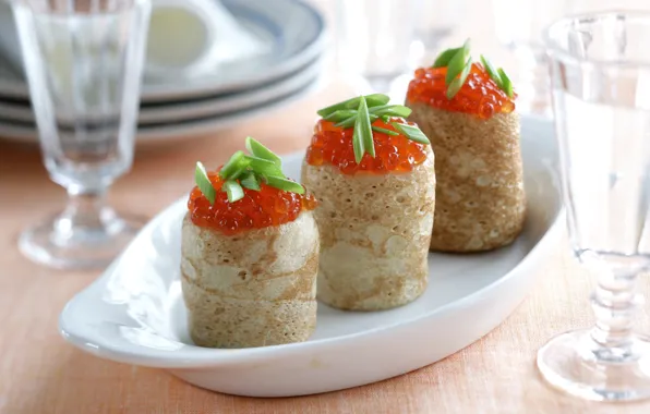 Pancakes, caviar, rolls