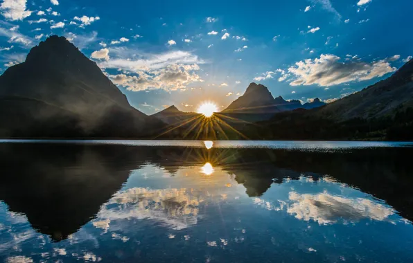 The sky, rays, mountains, lake, reflection, cloud. the sun