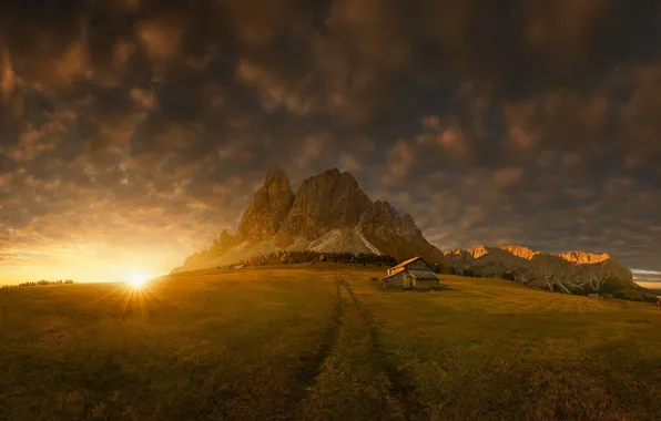 Field, the sun, mountains, house