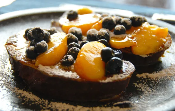 Berries, peach, powdered sugar, toast, French