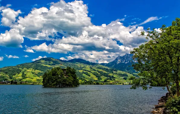 The sky, trees, mountains, lake, rocks, island