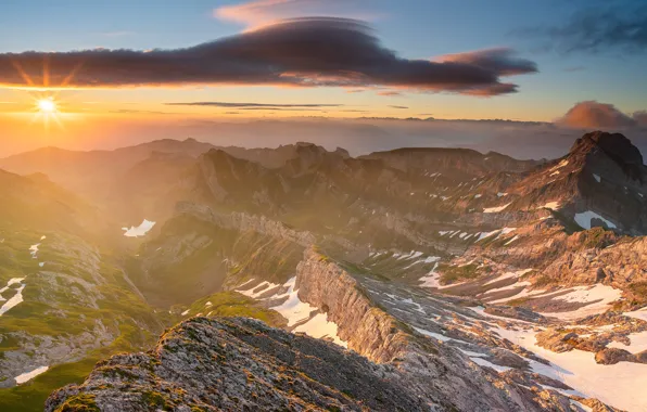 The sky, clouds, rays, snow, mountains, fog, rocks, dawn