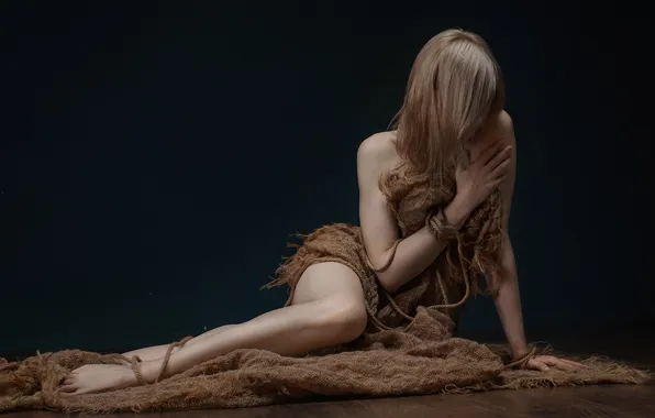 The dark background, shame, burlap, blonde hair, Nude model, eroticism, sitting on the floor, Victor …