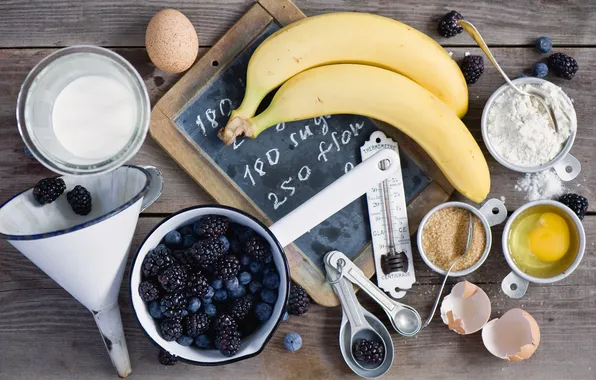 Berries, eggs, milk, blueberries, bananas, dishes, sugar, flour