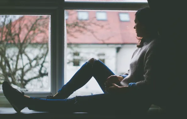 Picture Girl, sitting on the windowsill, and looking out the window