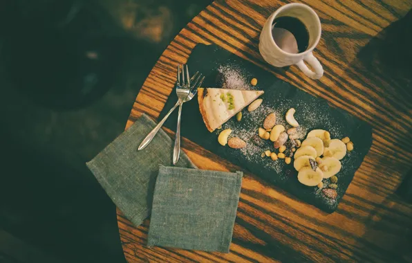 Table, coffee, pie, bananas, drink, nuts, nuts, fork