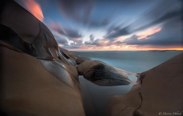 Stones, the ocean, dawn, shore