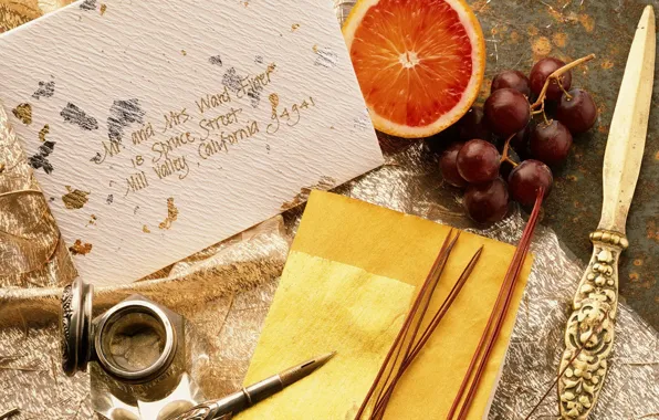 Letter, pen, grapes, grapefruit
