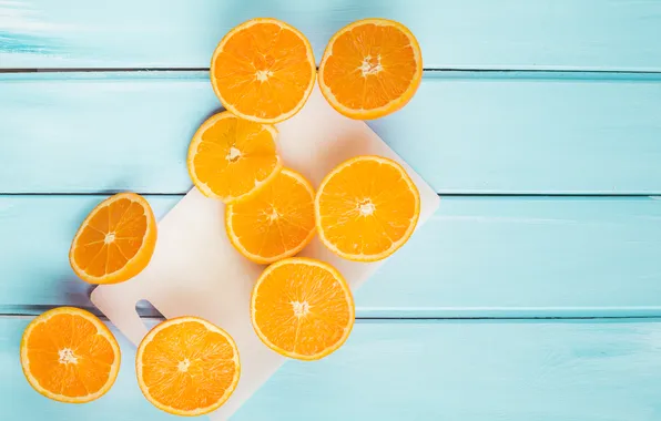 Oranges, blue background, slices