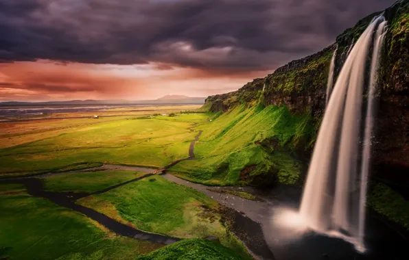 Clouds, waterfall, the evening, Iceland