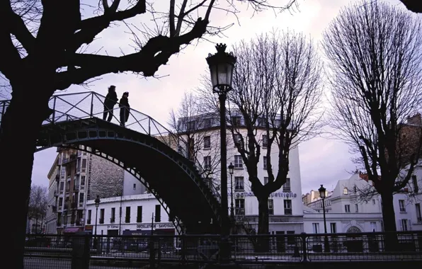 Bridge, the city, people, lights, a couple