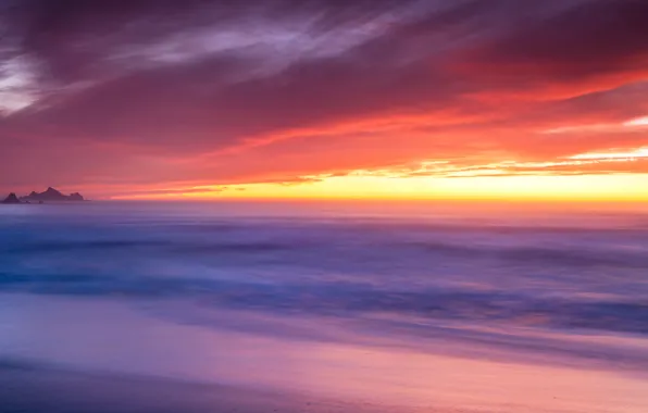 Picture the sky, sunset, fog, the ocean, rocks, horizon