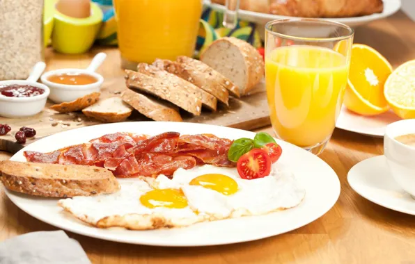 Breakfast, juice, scrambled eggs, tomato, bacon, toast