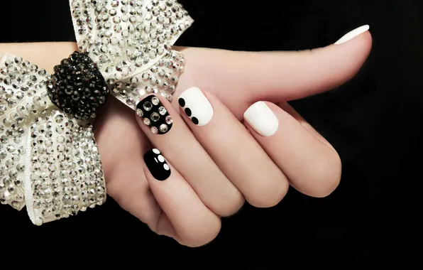 Picture hand, fingers, black background, bow, manicure