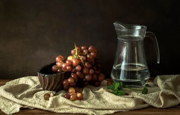Glass, the dark background, table, grapes, fabric, pitcher, fruit, still life