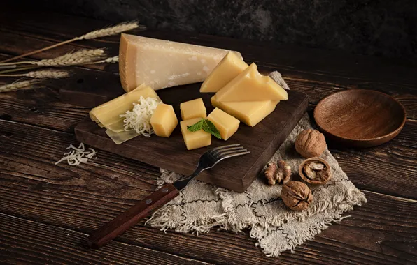 The dark background, table, Board, food, cheese, pieces, ears, plug