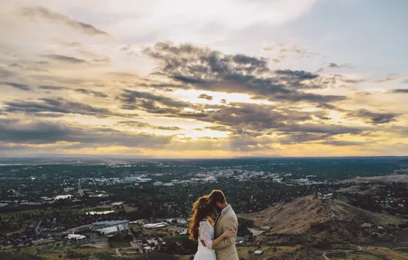 Picture the sky, clouds, the city, lovers, the bride, wreath, the groom