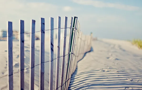 Beach, the sky, traces, the fence