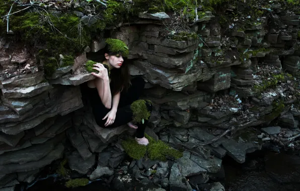 Girl, rocks, moss, the situation