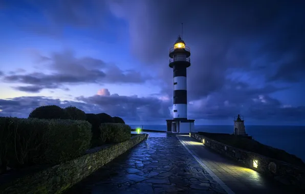 Sea, shore, lighthouse