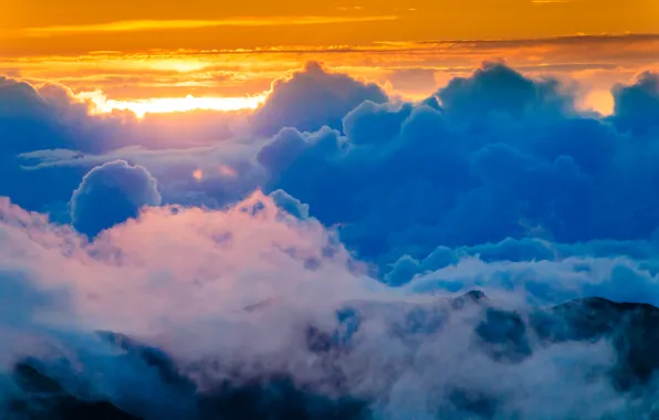 The sky, the sun, clouds, mountains, glow