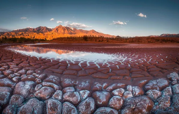 Clouds, light, mountains, cracked, lake, stones, shore