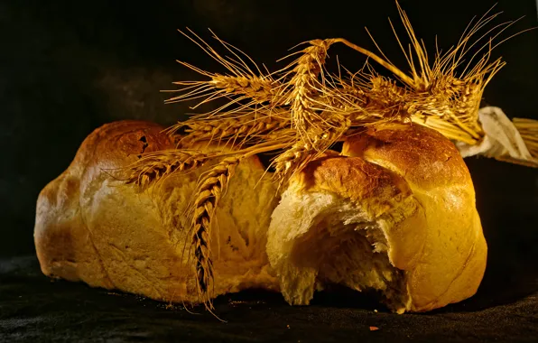 The dark background, bread, ears, buns, bakery products